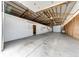 Expansive garage featuring a metal roof, multiple bays and plenty of storage at 73 N Dutch Valley Rd, Bennett, CO 80102