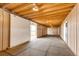 Interior of a barn or outbuilding with bright lighting and openings at 73 N Dutch Valley Rd, Bennett, CO 80102