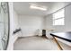 A well lit and spacious office with white walls, a desk, and a window at 73 N Dutch Valley Rd, Bennett, CO 80102
