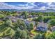 An aerial view of a well-maintained home surrounded by lush greenery and a scenic landscape at 2742 S Braun Way, Lakewood, CO 80228