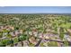 An aerial view captures the neighborhood, showcasing the home's location and surrounding greenery at 2742 S Braun Way, Lakewood, CO 80228