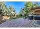 A beautifully landscaped backyard featuring a spacious patio and a well-maintained lawn area at 2742 S Braun Way, Lakewood, CO 80228