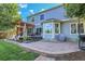Home's backyard boasts a large patio, pergola, and well-manicured lawn, perfect for outdoor living at 2742 S Braun Way, Lakewood, CO 80228