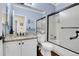 Bathroom featuring granite countertops, updated fixtures and a shower with glass doors at 2742 S Braun Way, Lakewood, CO 80228