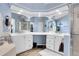 Spacious bathroom featuring dual sinks, ample counter space, and a walk-in shower at 2742 S Braun Way, Lakewood, CO 80228