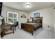 Comfortable bedroom with a desk, a window overlooking trees, and traditional decor at 2742 S Braun Way, Lakewood, CO 80228