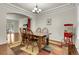 Dining room featuring hardwood floors, ceiling detail and table and chairs with a popcorn machine at 2742 S Braun Way, Lakewood, CO 80228