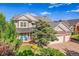 Charming two-story home with a well-maintained lawn, brick accents and a two car garage at 2742 S Braun Way, Lakewood, CO 80228