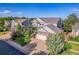 Exterior shot of a two-story home featuring a well-manicured lawn and a spacious two-car garage at 2742 S Braun Way, Lakewood, CO 80228