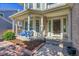 Charming front porch with a cozy seating area, providing a welcoming entrance to the home at 2742 S Braun Way, Lakewood, CO 80228