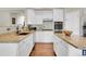 Well-lit kitchen featuring granite countertops, stainless steel appliances, and hardwood floors at 2742 S Braun Way, Lakewood, CO 80228