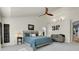 This main bedroom boasts vaulted ceilings, a ceiling fan, and a comfortable sitting area at 2742 S Braun Way, Lakewood, CO 80228