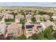 Picturesque aerial view of a neighborhood showcasing mature trees and well-maintained homes with solar panels at 6043 S Paris St, Greenwood Village, CO 80111