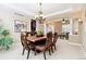 Elegant dining room with open layout, stylish chandelier, and views to other rooms at 6043 S Paris St, Greenwood Village, CO 80111