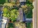 Aerial view of home with solar panel and lush yard and mature trees at 2235 Edgewood Dr, Boulder, CO 80304