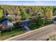 Home featuring a lush green lawn, an updated roof, solar panels and mature trees at 2235 Edgewood Dr, Boulder, CO 80304