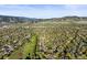 Breathtaking aerial view showcases the community, and mountain vista in the distance at 2235 Edgewood Dr, Boulder, CO 80304