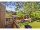 Elevated view of a landscaped backyard with a patio, artificial turf, and mature trees at 2235 Edgewood Dr, Boulder, CO 80304