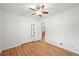 Bright bedroom features hardwood floors, a ceiling fan, a closet, and white walls at 2235 Edgewood Dr, Boulder, CO 80304