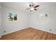 Bedroom with hardwood floors, ceiling fan, and two windows offering ample natural light at 2235 Edgewood Dr, Boulder, CO 80304