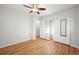 Bedroom featuring hardwood floors, a ceiling fan, closet, and an open doorway at 2235 Edgewood Dr, Boulder, CO 80304