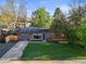 Charming home with a well-manicured lawn, solar panel, and driveway for easy parking at 2235 Edgewood Dr, Boulder, CO 80304