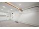 Spacious garage featuring carpet, storage, utility door, and access to the main residence at 2235 Edgewood Dr, Boulder, CO 80304