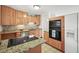 Cozy kitchen features granite countertops, backsplash and stainless steel appliances at 2235 Edgewood Dr, Boulder, CO 80304