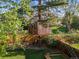 Backyard treehouse featuring wooden construction, a ladder, and a surrounding wooden fence for privacy at 2235 Edgewood Dr, Boulder, CO 80304