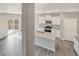 Modern kitchen with white cabinets, stainless appliances, and granite countertops at 13466 Valentia St, Thornton, CO 80602