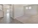 Neutral living room with modern floors and large open floorplan at 13466 Valentia St, Thornton, CO 80602
