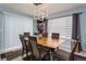 Bright dining room with hardwood floors and modern light fixture at 19696 E 50Th Ave, Denver, CO 80249