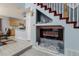 Modern electric fireplace and built-in shelving in Gathering room at 19696 E 50Th Ave, Denver, CO 80249