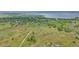 An aerial view of land with walking trails, trees and a body of water at 3870 S Ouray Way, Aurora, CO 80013