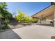 A beautiful backyard with a patio, trees, and clear blue skies at 3870 S Ouray Way, Aurora, CO 80013