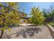 A backyard featuring a patio and trees in a beautiful outdoor setting at 3870 S Ouray Way, Aurora, CO 80013