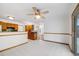 Bright open-concept dining area with tile floors and access to the outdoors at 3870 S Ouray Way, Aurora, CO 80013