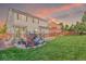 Spacious backyard featuring a patio and lush lawn space at 129 N Irvington St, Aurora, CO 80018