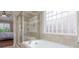 This bathroom features a walk-in shower and a soaking tub at 129 N Irvington St, Aurora, CO 80018