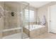 The bathroom features a walk-in shower and a soaking tub at 129 N Irvington St, Aurora, CO 80018