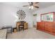 Bright bedroom featuring wood desk and dresser set and a decorative windmill wall decoration at 129 N Irvington St, Aurora, CO 80018