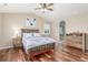 A bedroom featuring hardwood floors and a vaulted ceiling at 129 N Irvington St, Aurora, CO 80018