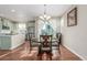 Dining area featuring stylish chandelier and table with backyard views at 129 N Irvington St, Aurora, CO 80018