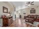 The living room features hardwood floors, a fireplace, and a leather sofa at 129 N Irvington St, Aurora, CO 80018