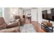 Cozy sitting room with hardwood floors, and two comfortable armchairs at 129 N Irvington St, Aurora, CO 80018