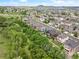 Areal view of suburban neighborhood with many houses and green landscaping at 3834 Donnington Cir, Castle Rock, CO 80104