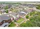 Aerial view of a home with a well-maintained backyard, including artificial turf and a deck, in a suburban neighborhood at 3834 Donnington Cir, Castle Rock, CO 80104