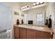 Bathroom with double sinks, granite counters, framed mirror, and a separate shower at 3834 Donnington Cir, Castle Rock, CO 80104
