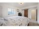 Bedroom with a large window, aviation theme, and sliding barn door to en-suite bathroom at 3834 Donnington Cir, Castle Rock, CO 80104