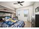 Fun bedroom featuring a bunk bed, plush toys, and a window overlooking the yard at 3834 Donnington Cir, Castle Rock, CO 80104